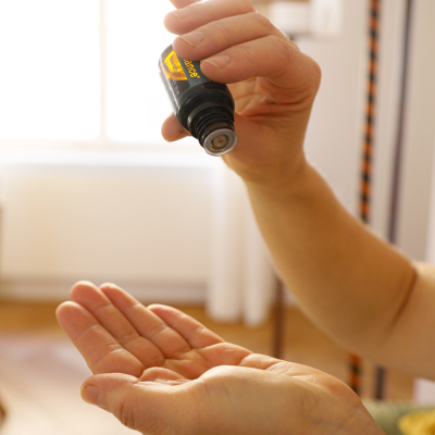 putting essential oils in hand